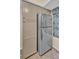 Kitchen featuring stainless steel refrigerator with built-in cabinets and decorative window shade at 401 Yacht Harbor Ct, Isle of Palms, SC 29451