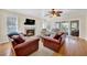Inviting living room with fireplace, comfortable seating, and sliding glass doors at 401 Yacht Harbor Ct, Isle of Palms, SC 29451