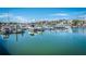 Picturesque marina with various boats docked, reflecting on the calm water under a partly cloudy sky at 401 Yacht Harbor Ct, Isle of Palms, SC 29451