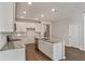 Modern kitchen with white cabinetry, stainless steel appliances, and a granite countertop island at 402 Duskywing Dr, Goose Creek, SC 29445