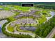 An aerial view of Cane Bay High School with parking, athletic fields and natural pond at 402 Spectrum Rd, Summerville, SC 29486