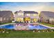 Beautiful backyard with a large pool, lush lawn, brick patio, and comfortable outdoor seating area at 402 Spectrum Rd, Summerville, SC 29486