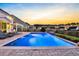 Inviting backyard featuring a swimming pool, outdoor seating, and a scenic view of the adjacent pond at 402 Spectrum Rd, Summerville, SC 29486
