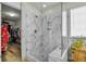Modern bathroom features glass shower with white marble tiling and wooden floors at 402 Spectrum Rd, Summerville, SC 29486