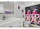 Stylish bathroom with floral shower curtain, white vanity, and modern sink fixtures at 402 Spectrum Rd, Summerville, SC 29486