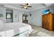 This bedroom has an en-suite bathroom, tray ceilings, and a relaxing ambiance at 402 Spectrum Rd, Summerville, SC 29486