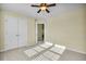 Bright bedroom featuring a ceiling fan, neutral walls, and access to a closet at 402 Spectrum Rd, Summerville, SC 29486
