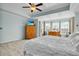 Comfortable bedroom with tray ceilings, neutral carpet, and bright natural light at 402 Spectrum Rd, Summerville, SC 29486