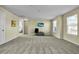 Spacious bonus room with cozy carpet, TV, and ample space for versatile activities at 402 Spectrum Rd, Summerville, SC 29486