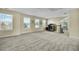 Bright, expansive bonus room with multiple windows offering scenic neighborhood views at 402 Spectrum Rd, Summerville, SC 29486