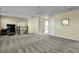 Spacious bonus room with plush carpeting, neutral paint, and staircase with wooden railing at 402 Spectrum Rd, Summerville, SC 29486
