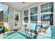 Relaxing covered patio with comfortable seating and ample natural light at 402 Spectrum Rd, Summerville, SC 29486