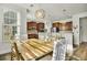 Dining area with modern pendant lights, seamlessly connecting kitchen and table at 402 Spectrum Rd, Summerville, SC 29486