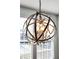 Contemporary dining room illuminated by a stylish chandelier, complemented by natural light at 402 Spectrum Rd, Summerville, SC 29486