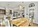 Inviting open-concept space with dining area flowing into the living room, featuring modern lighting at 402 Spectrum Rd, Summerville, SC 29486