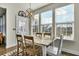 Cozy dining area bathed in natural light, featuring a modern chandelier and easy access to the outdoors at 402 Spectrum Rd, Summerville, SC 29486