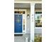 Charming blue front door with decorative wreath and bright sidelight window at 402 Spectrum Rd, Summerville, SC 29486