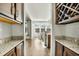 Hallway view through to the dining area featuring a granite countertop and wine rack at 402 Spectrum Rd, Summerville, SC 29486