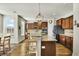Bright kitchen with a large island, granite countertops, stainless appliances, and wooden cabinets at 402 Spectrum Rd, Summerville, SC 29486