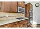 Gourmet kitchen boasts stainless steel appliances, custom cabinetry, and granite countertops at 402 Spectrum Rd, Summerville, SC 29486