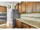 Kitchen featuring stainless steel appliances, granite countertops, and stylish wooden cabinets at 402 Spectrum Rd, Summerville, SC 29486