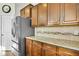 Kitchen showcasing stainless steel appliances, a granite countertop, and lovely wooden cabinets at 402 Spectrum Rd, Summerville, SC 29486