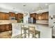 Well-lit kitchen featuring granite countertops, stainless steel appliances, and wooden cabinets at 402 Spectrum Rd, Summerville, SC 29486