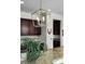 Modern kitchen featuring a stainless steel pendant light, granite countertops, and dark wood cabinets at 402 Spectrum Rd, Summerville, SC 29486