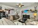 Bright living room with hardwood floors, ceiling fan, and decorative shelving for a cozy atmosphere at 402 Spectrum Rd, Summerville, SC 29486