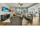 Spacious living room featuring plush seating, hardwood floors, and a bright, airy atmosphere at 402 Spectrum Rd, Summerville, SC 29486