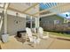 Outdoor patio featuring a pergola, comfortable seating, and a view of the backyard at 402 Spectrum Rd, Summerville, SC 29486