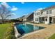 Backyard with a pool and patio near the lake, with a view of neighboring homes at 402 Spectrum Rd, Summerville, SC 29486