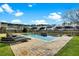 Beautiful backyard pool featuring a stone surround and waterfall, alongside chaise lounges for relaxation at 402 Spectrum Rd, Summerville, SC 29486