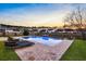 Backyard pool with lounge chairs, brick patio, and serene views of the surrounding neighborhood at 402 Spectrum Rd, Summerville, SC 29486