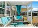Cozy screened porch with wicker furniture and an outdoor view at 402 Spectrum Rd, Summerville, SC 29486