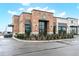 Exterior of brick Starbucks with drive thru, ample parking, and outdoor seating under awnings at 402 Spectrum Rd, Summerville, SC 29486