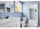 Bright bathroom featuring modern vanity and fixtures, with a view into the bedroom at 407 Hayne St, Walterboro, SC 29488