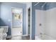 Bathroom featuring a tub-shower combo and vanity, with a glimpse into an adjacent room at 407 Hayne St, Walterboro, SC 29488