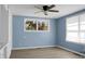 Bedroom with a ceiling fan and built-in shelving, cabinets, and drawers at 407 Hayne St, Walterboro, SC 29488