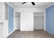 Bedroom with a built-in unit featuring cabinets, drawers, and shelving units at 407 Hayne St, Walterboro, SC 29488