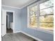 Bedroom with neutral walls and a double window overlooking a large green space at 407 Hayne St, Walterboro, SC 29488