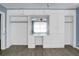 Bedroom with full wall of built-in storage cabinets, drawers, and shelving unit at 407 Hayne St, Walterboro, SC 29488