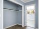 Closet showcasing an open layout, neutral walls, and a glimpse of a well-lit room at 407 Hayne St, Walterboro, SC 29488