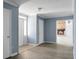 Entryway showing the floorplan, white doors, and a view of the brick fireplace in the living room at 407 Hayne St, Walterboro, SC 29488