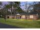Charming single-story brick home with a well-maintained lawn and mature trees at 407 Hayne St, Walterboro, SC 29488