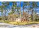 Charming brick home with a traditional design, accented by mature trees and a well-kept yard at 407 Hayne St, Walterboro, SC 29488
