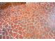 Close-up of unique mosaic tile flooring in an enclosed sunroom at 407 Hayne St, Walterboro, SC 29488