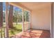 Side view of front porch with white columns and brick foundation at 407 Hayne St, Walterboro, SC 29488