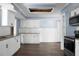 Bright kitchen featuring white cabinets, granite countertops, and stainless steel appliances at 407 Hayne St, Walterboro, SC 29488