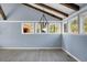 Living room featuring wood beams, a modern light fixture and lots of natural light at 407 Hayne St, Walterboro, SC 29488
